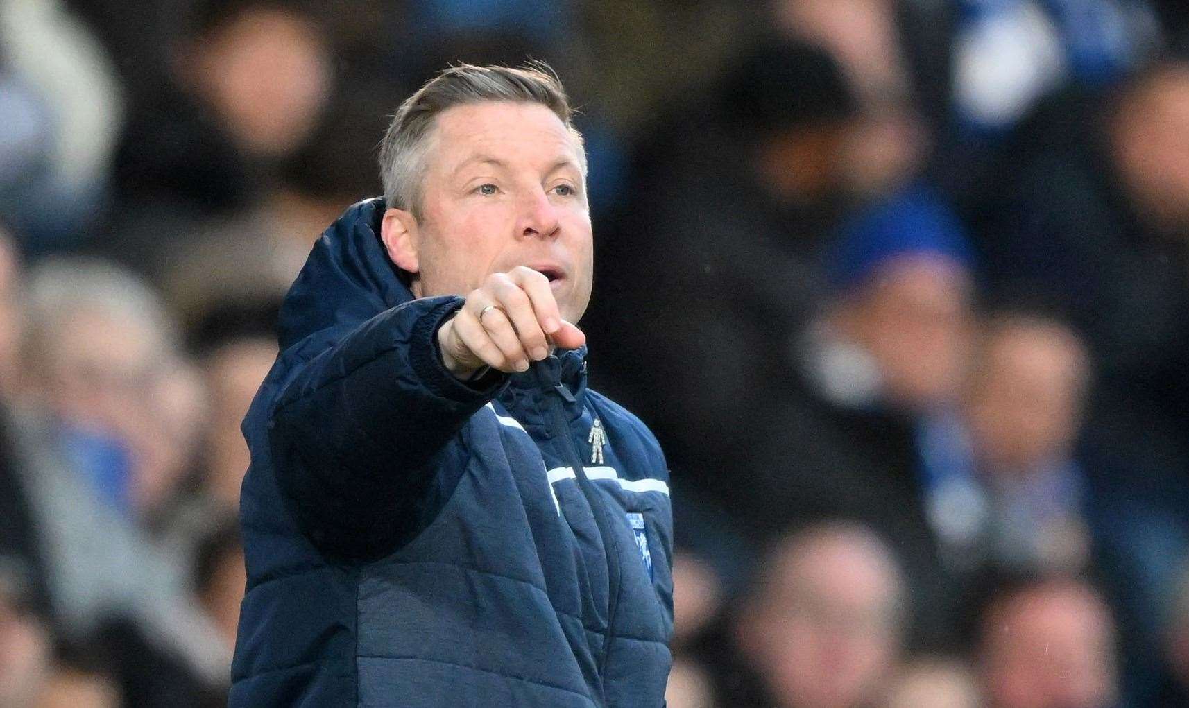 Manager Neil Harris welcomes his Gillingham players back on Wednesday