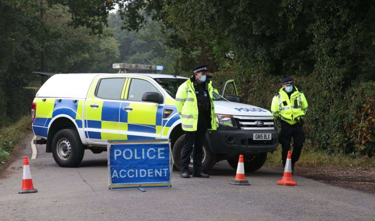 Police at the scene of the crash on Lenham Road, where four men died