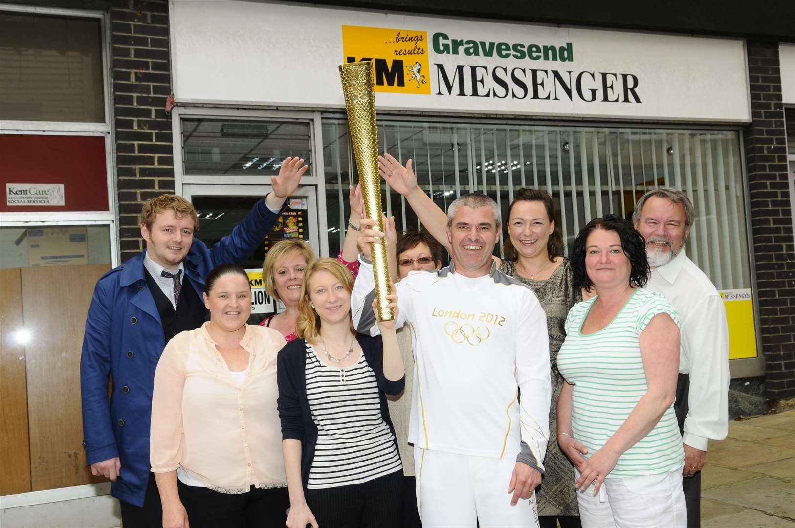 Paul Cloke, who carried the Olympic torch in Sheffield, with the KM's Gravesend Messenger team
