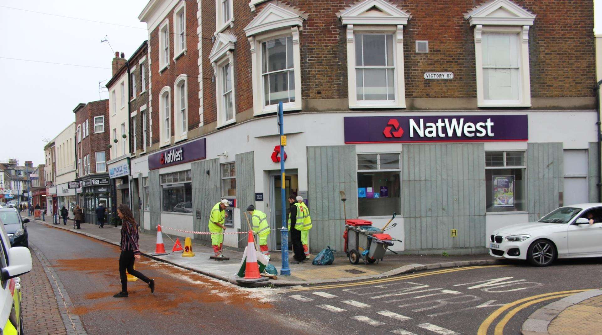 Workers cleaned up the pavement after a woman slipping on oil in Sheerness High Street on Monday