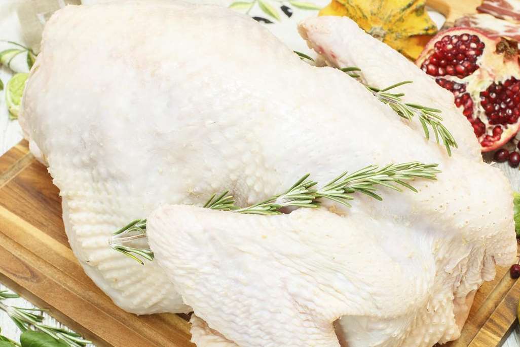 Rubbing garlic and herb butter under the bird's skin will make it crisp and golden