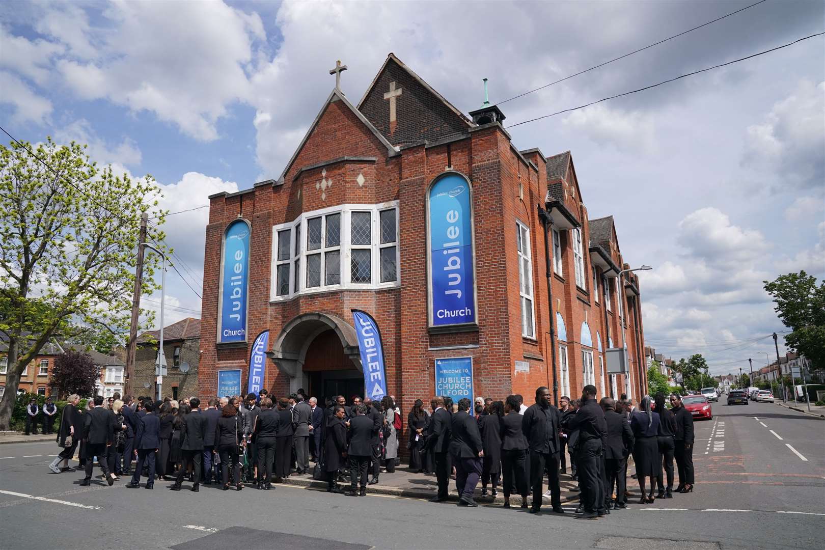 Mourners gather outside Jubilee Church in Ilford (Jonathan Brady/PA)