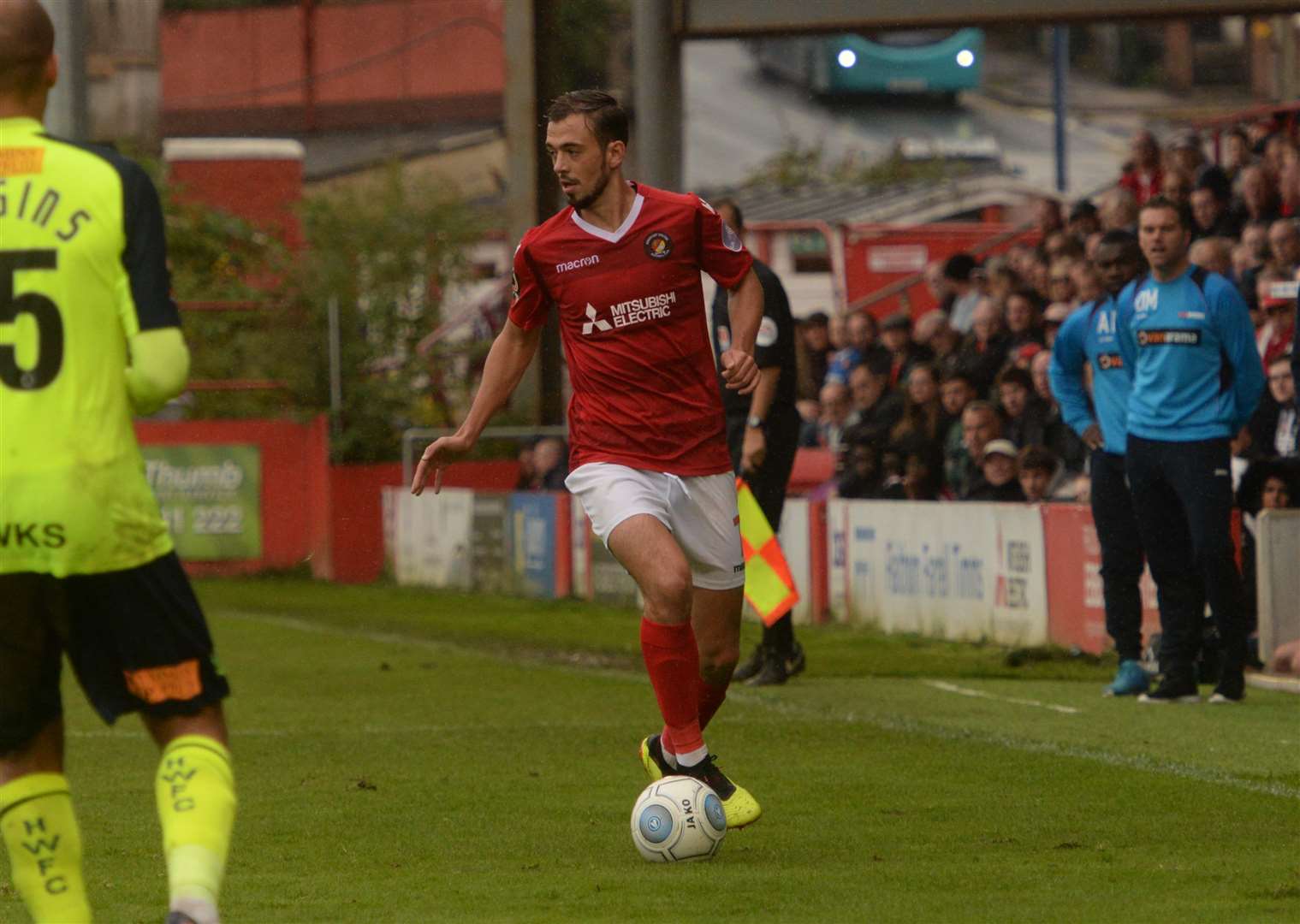 Jack Powell on the ball, watched by Ebbsfleet boss Daryl McMahon Picture: Chris Davey