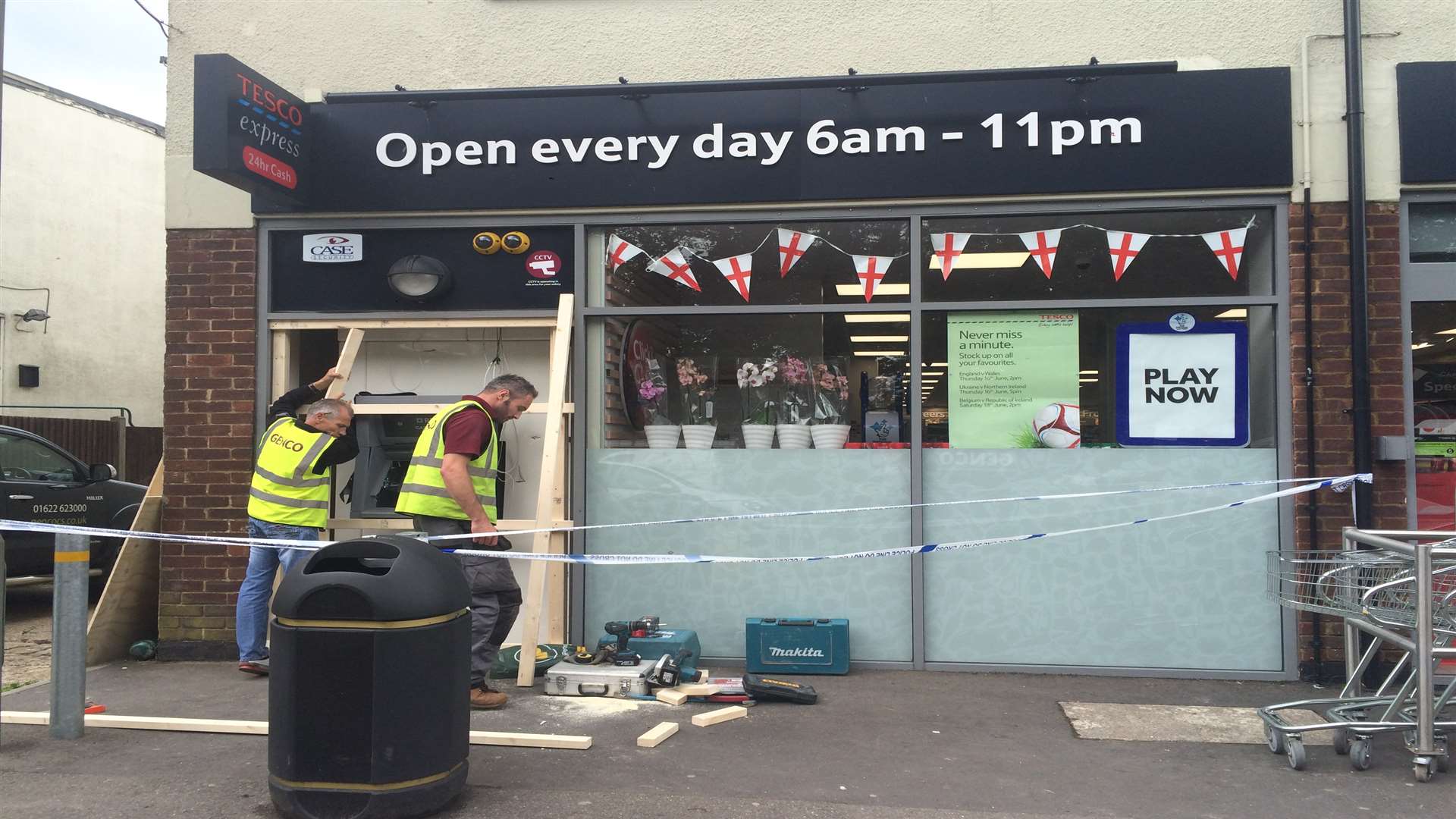 Workmen board up the Tesco Express in The Parade, Wrotham Road, Meopham