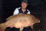 Luke Nichollson holding his 34lb carp