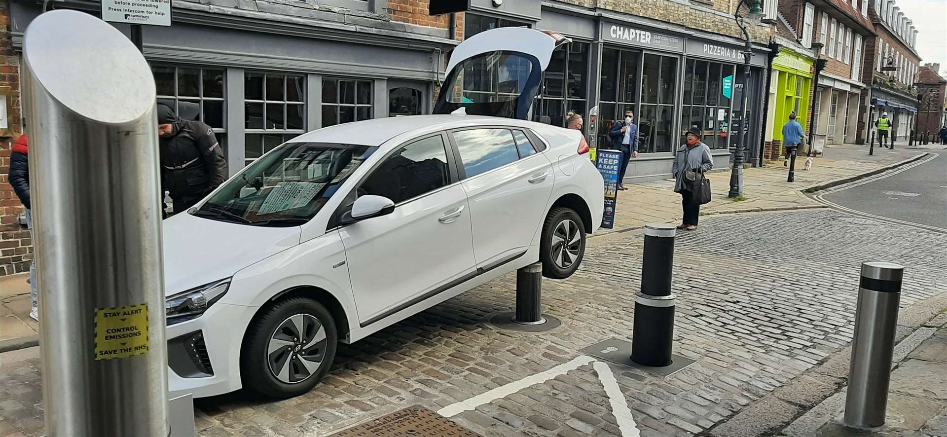 The Hyundai trapped on top of an anti-terror bollard. Picture: Andrew Corby