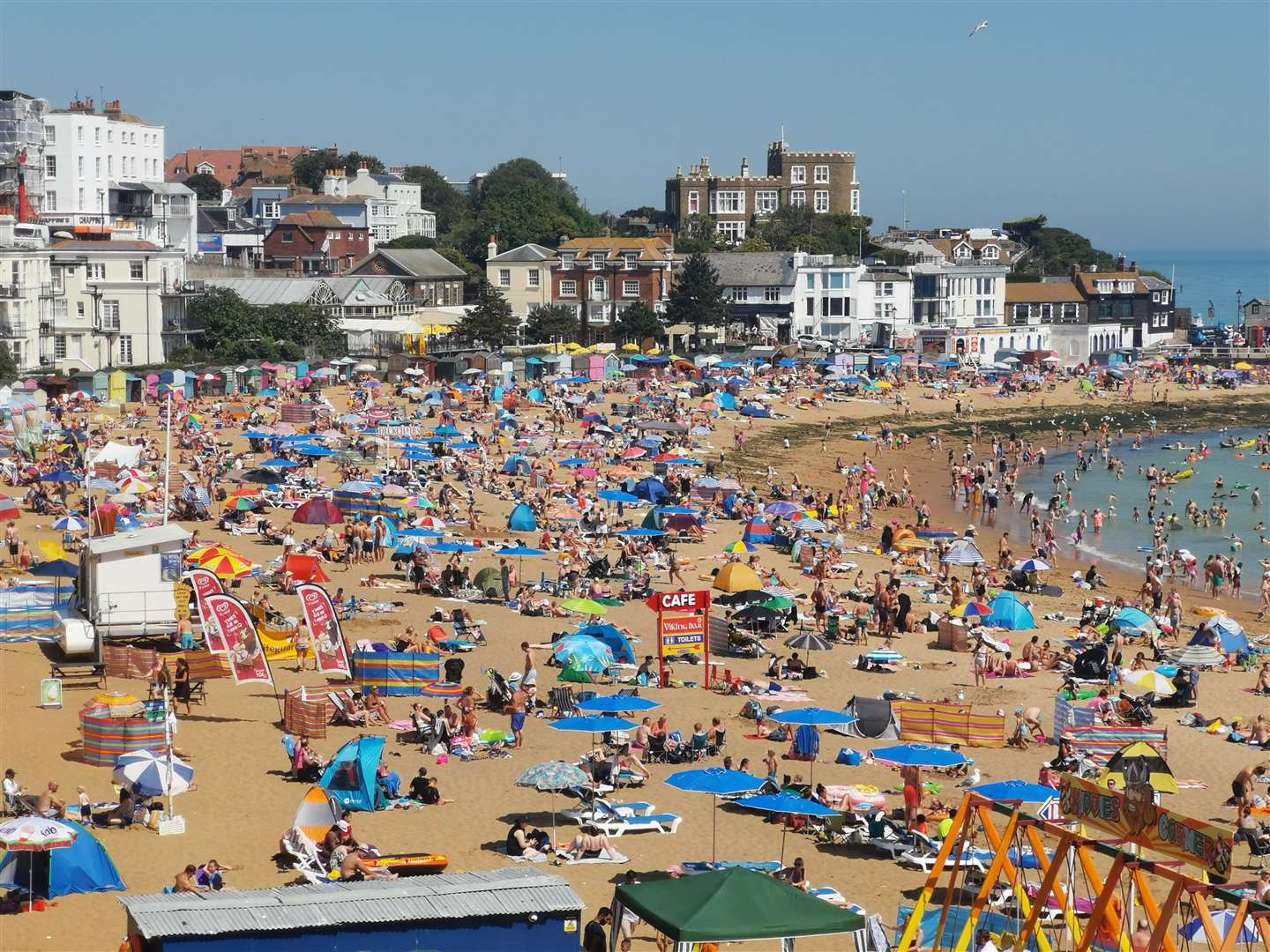 Crowds flock to the beach during warm weather