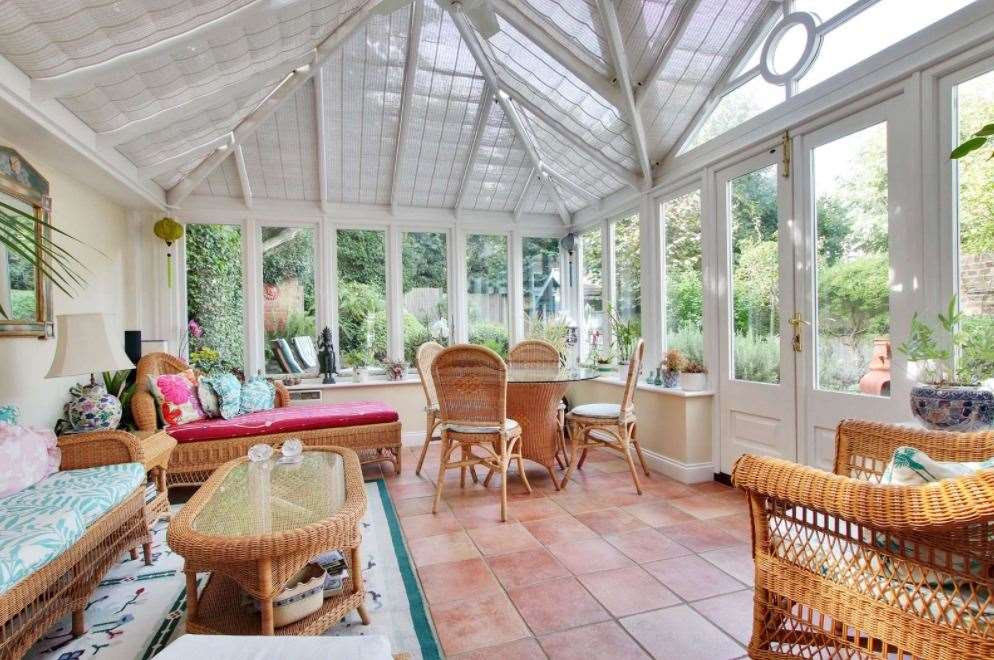Enjoy peaceful garden views from the conservatory. Picture: Savills