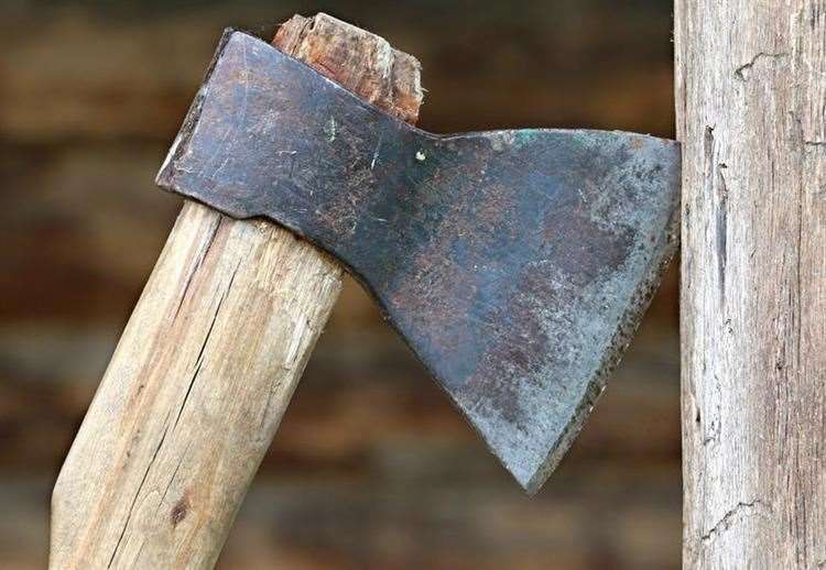 The man was seen brandishing an axe outside the college