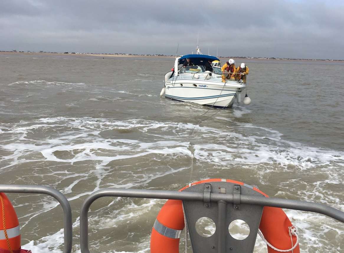 The cabin cruiser was towed to safety. Picture: Dungeness RNLI