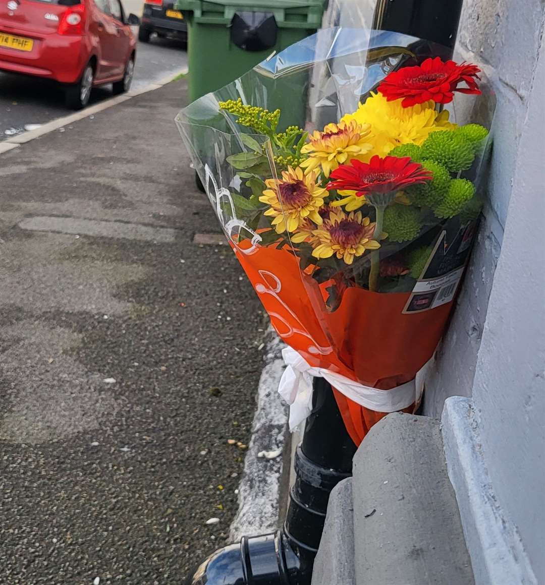 A floral tribute was placed at the scene of the fatal attack in New Street, Folkestone