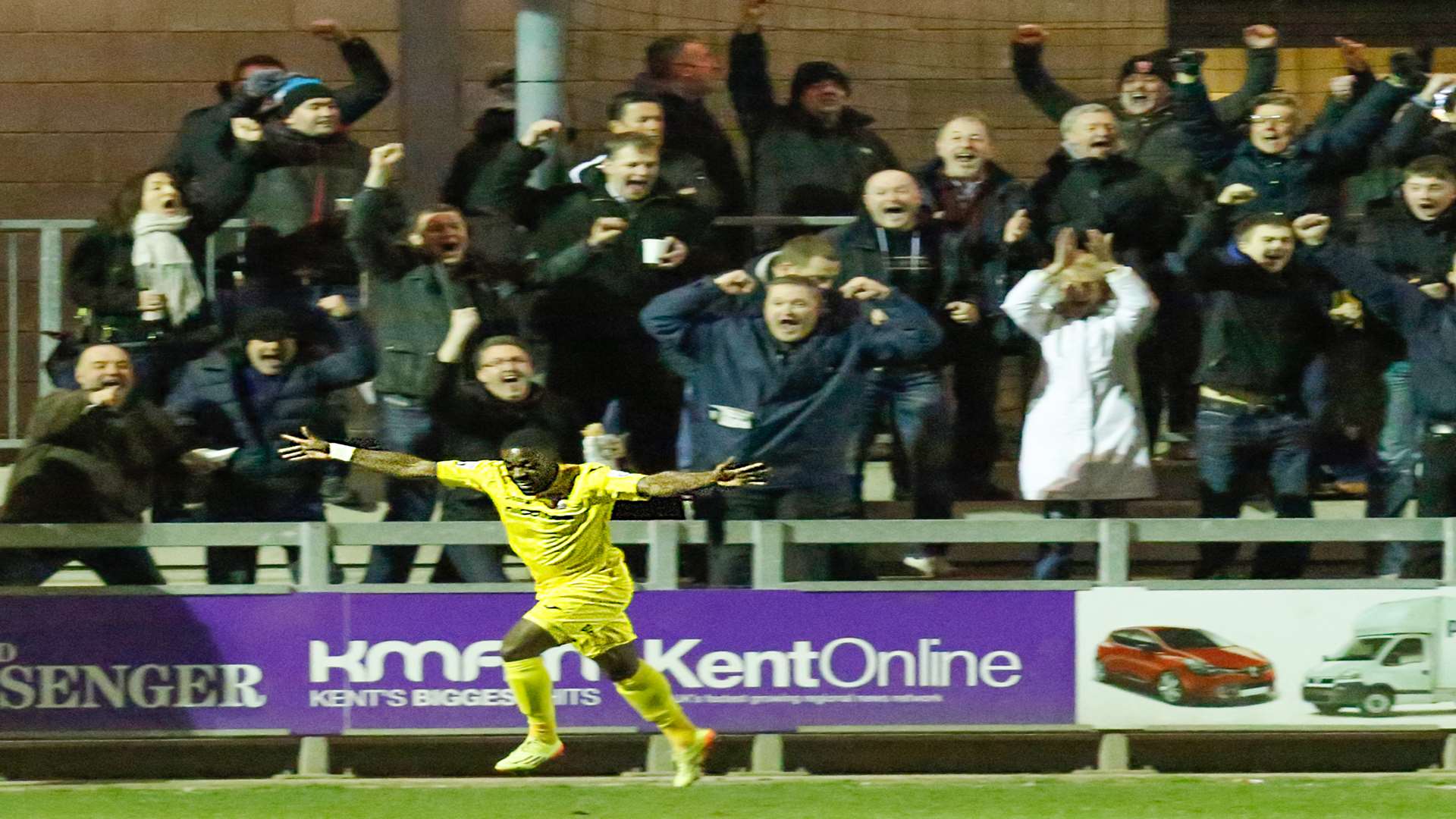 Yemi Odubade celebrates his goal in front of the Woking fans Picture: Matthew Walker