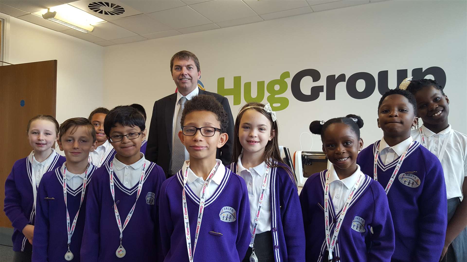 Pupils from Dartford Bridge Community Primary School with MP Gareth Johnson at Hug Group's office in Dartford