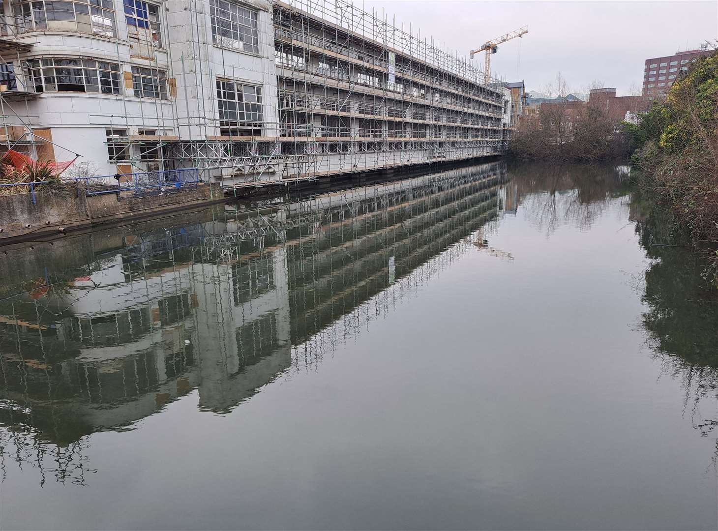 The millpond on the River Len beside the former Rootes building has been described as a "sewage settlement lagoon"