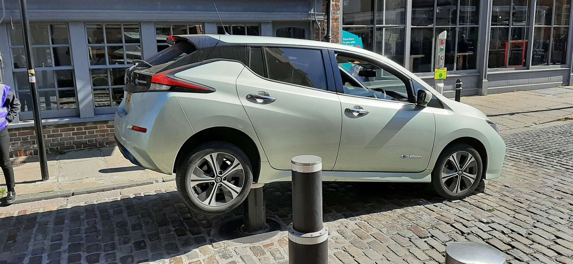 A Nissan Leaf trapped on top of the bollards Picture: Andrew Corby