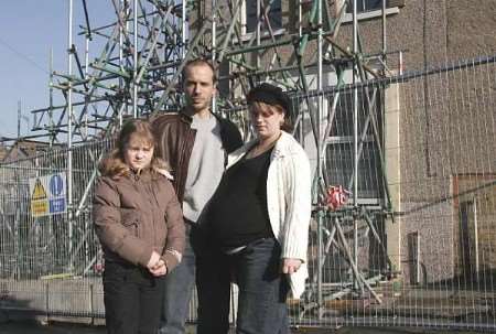 Members of the family outside their sinking premises. Pictures: PETER STILL