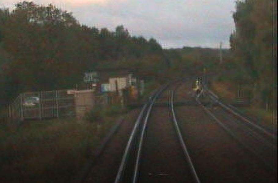 The cyclist dashing over the tracks seconds before the train arrived. Picture: Network Rail