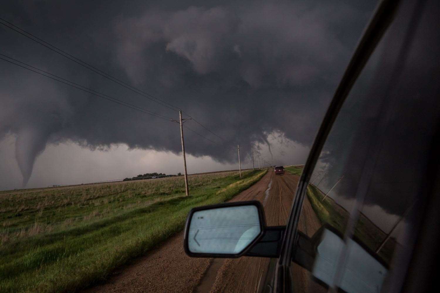 He captured this image of a tornado hitting the ground in three places while in Dodge City USA on May 24 2016. Pictures David Christie of Crystal Memories