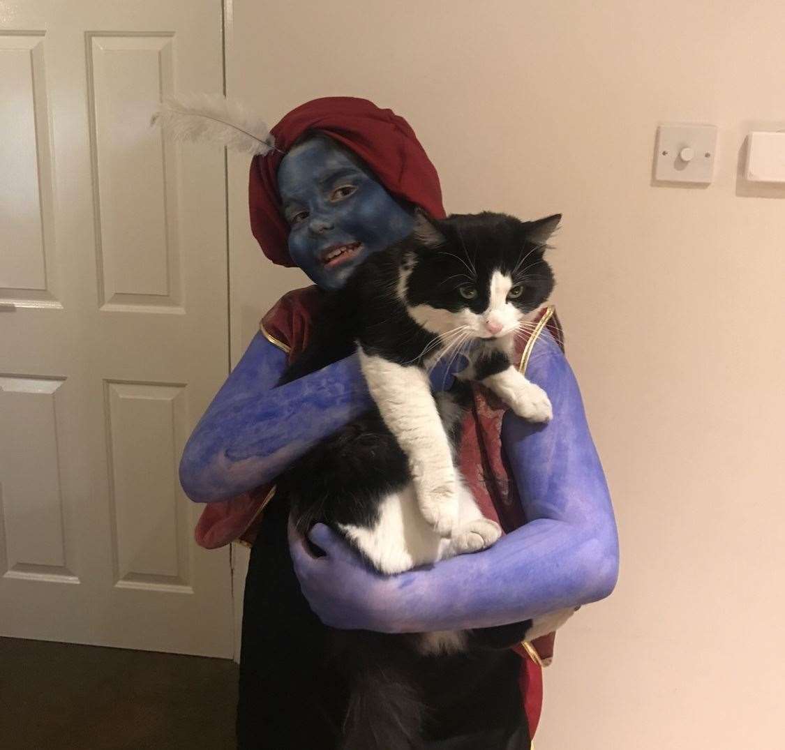 Liam, who is dressed as the Genie from Aladdin, with his much loved pet Ranger. Picture: Keeley Richards (31557457)