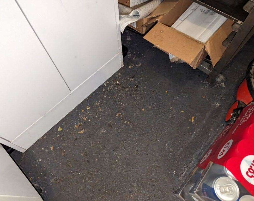 The floor near the oven was dirty