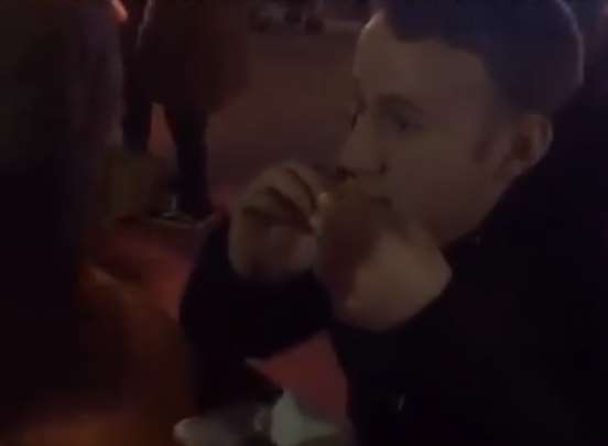 A man stops mid-bite for the challenge