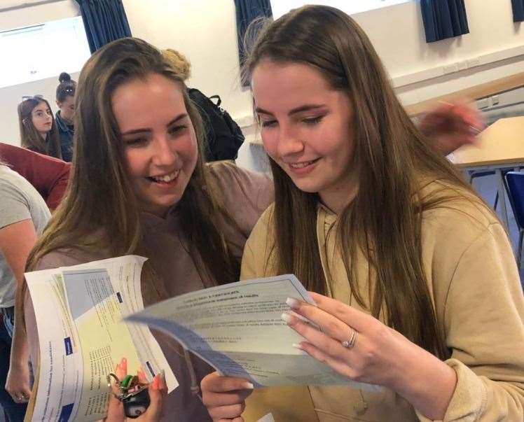 Twins Holly and Olivia Copley pore over their results (15297630)