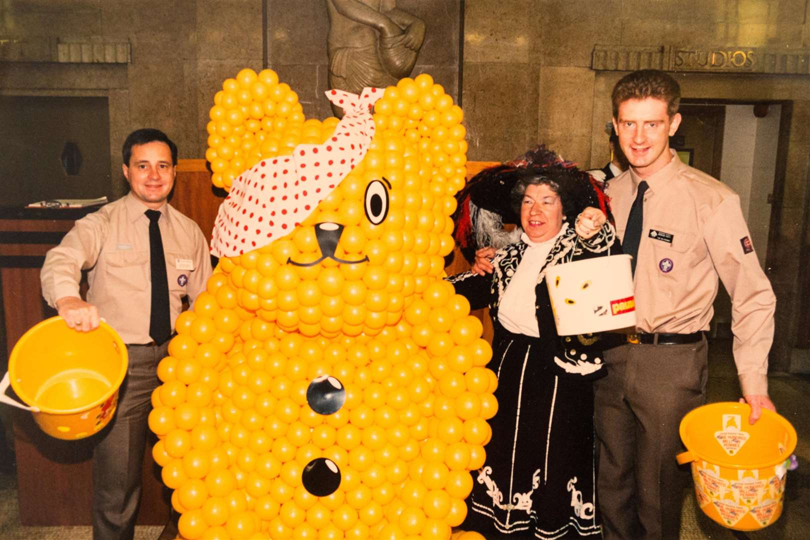 Collect photo of the late Joyce Rose, a former tea lady at at the BBC who gave bosses the idea for Children In Need seen here with Pudsey and scouts at the BBC studios. Picture: SWMS (5462649)