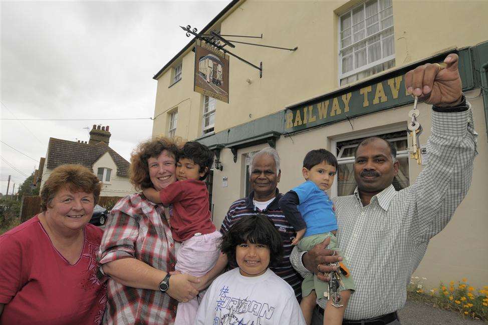 Hari and Katherine Johnston and family outside the Railway Tavern after buying the pub from Enterprise Inns in 2009