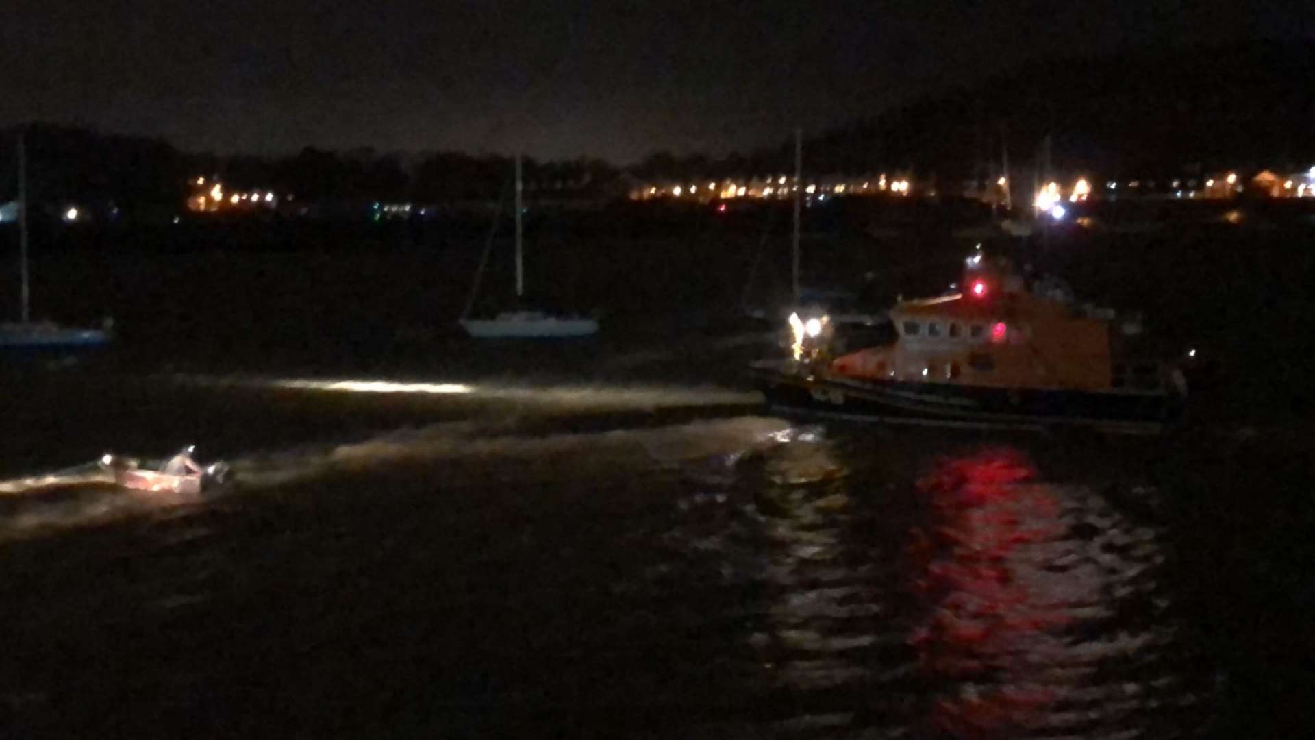 Lifeboat crews attempt to rescue a man from the river Medway during Storm Dennis. Picture by Stacey Gallagher
