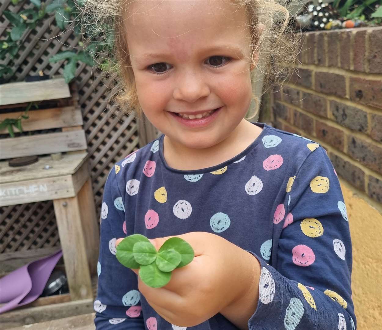 Rose posing with her five-leaf clover. Picture: Jay Lowing