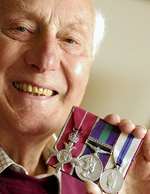 John Olley MBE with his medals