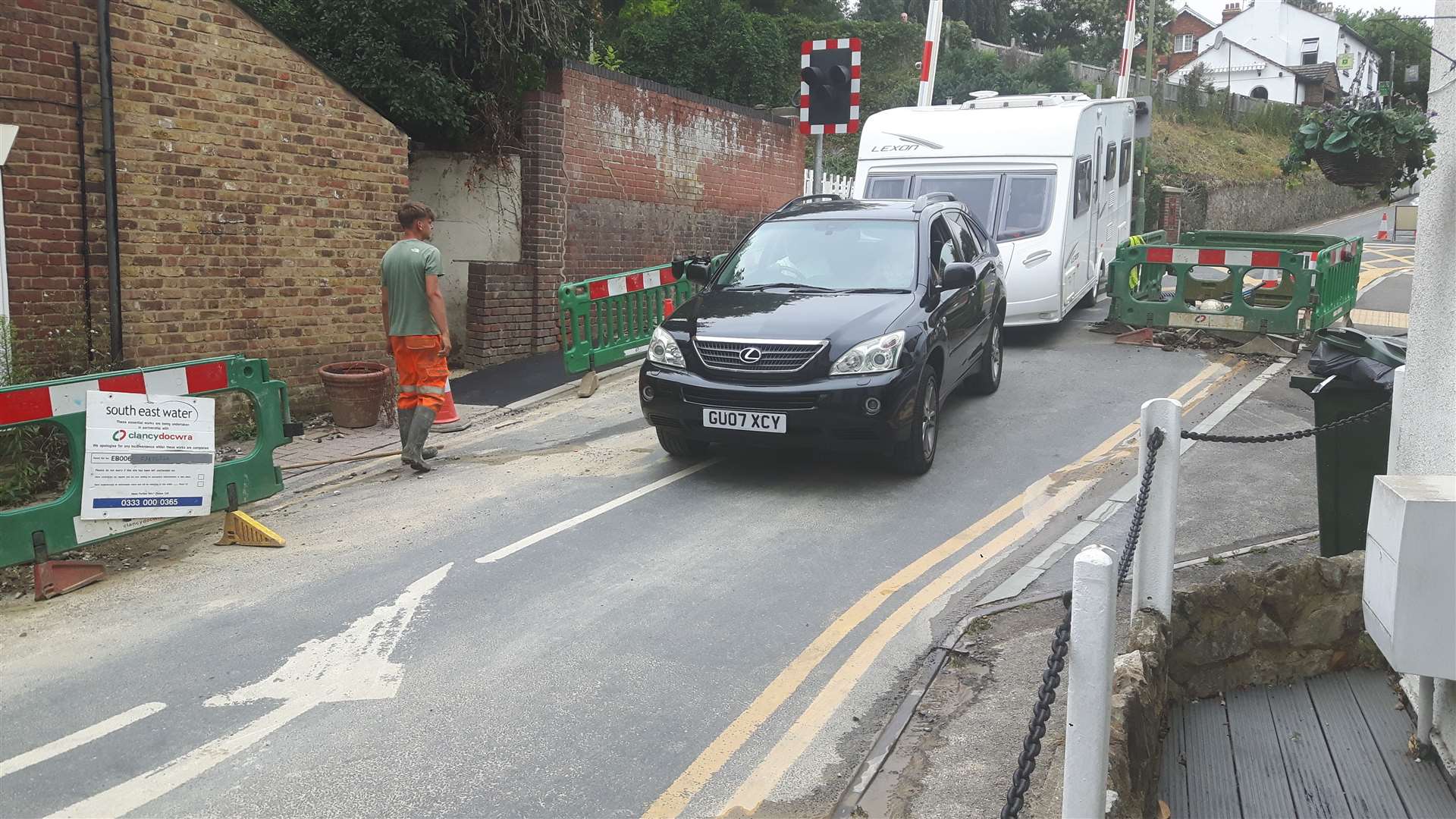 Workmen opened the road to allow this caravan owner to access Riverside Park