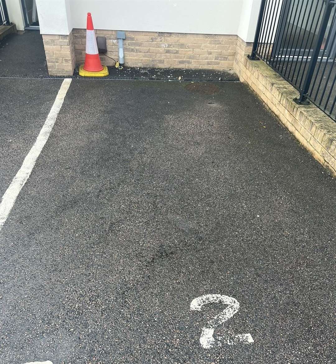 The man's allotted parking space at the flats