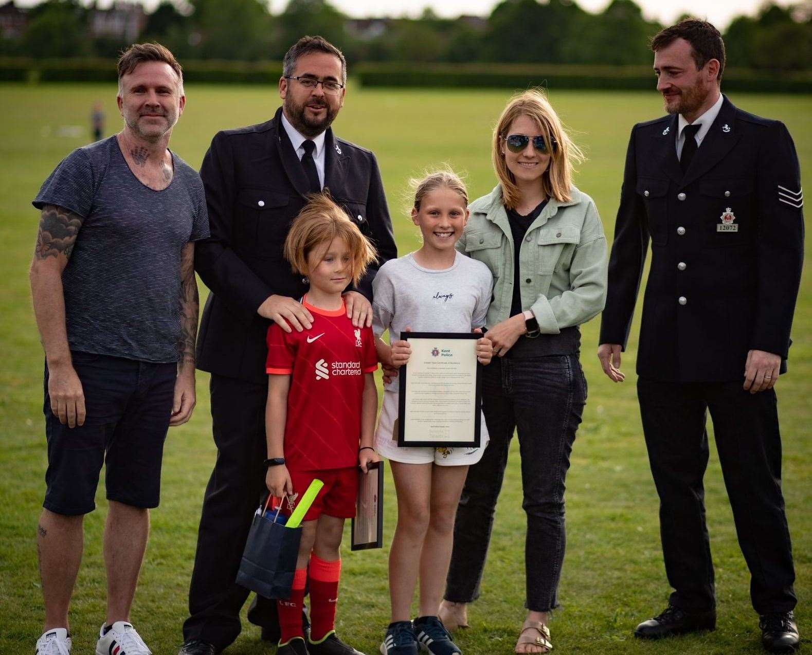 Sadie and Jude being given their award. Picture: Kent Police