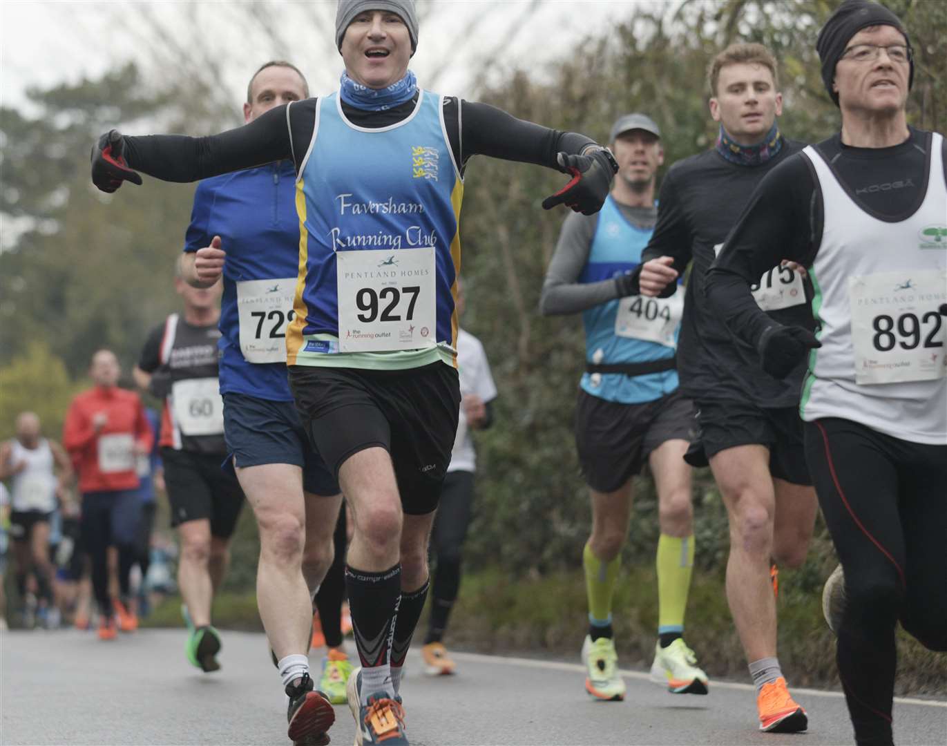 Nick O'Shea of Faversham Running Club (No.927) keeps his spirits up. Picture: Barry Goodwin (62013624)
