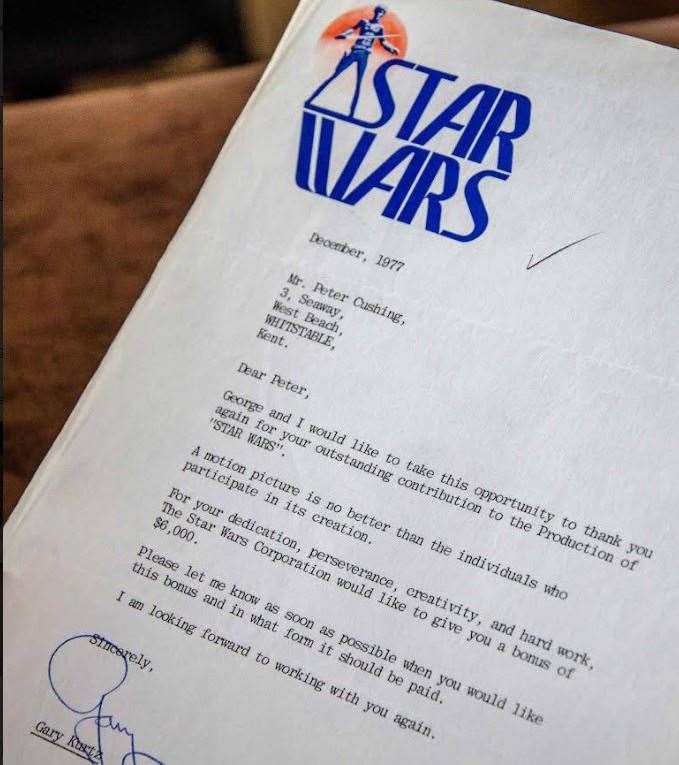 A letter informing Cushing of his Stars Wars film bonus on rare headed notepaper