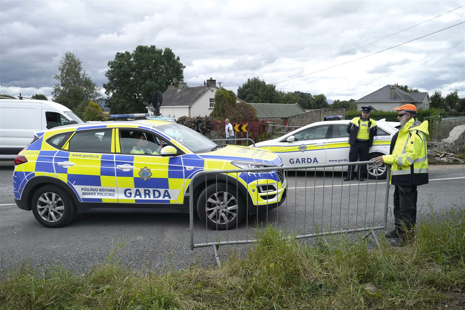 Garda close the road where the crash occurred (Niall Carson/PA)