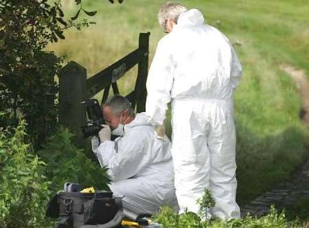 Police forensic experts at the scene of the assault. Picture: MARTIN APPS