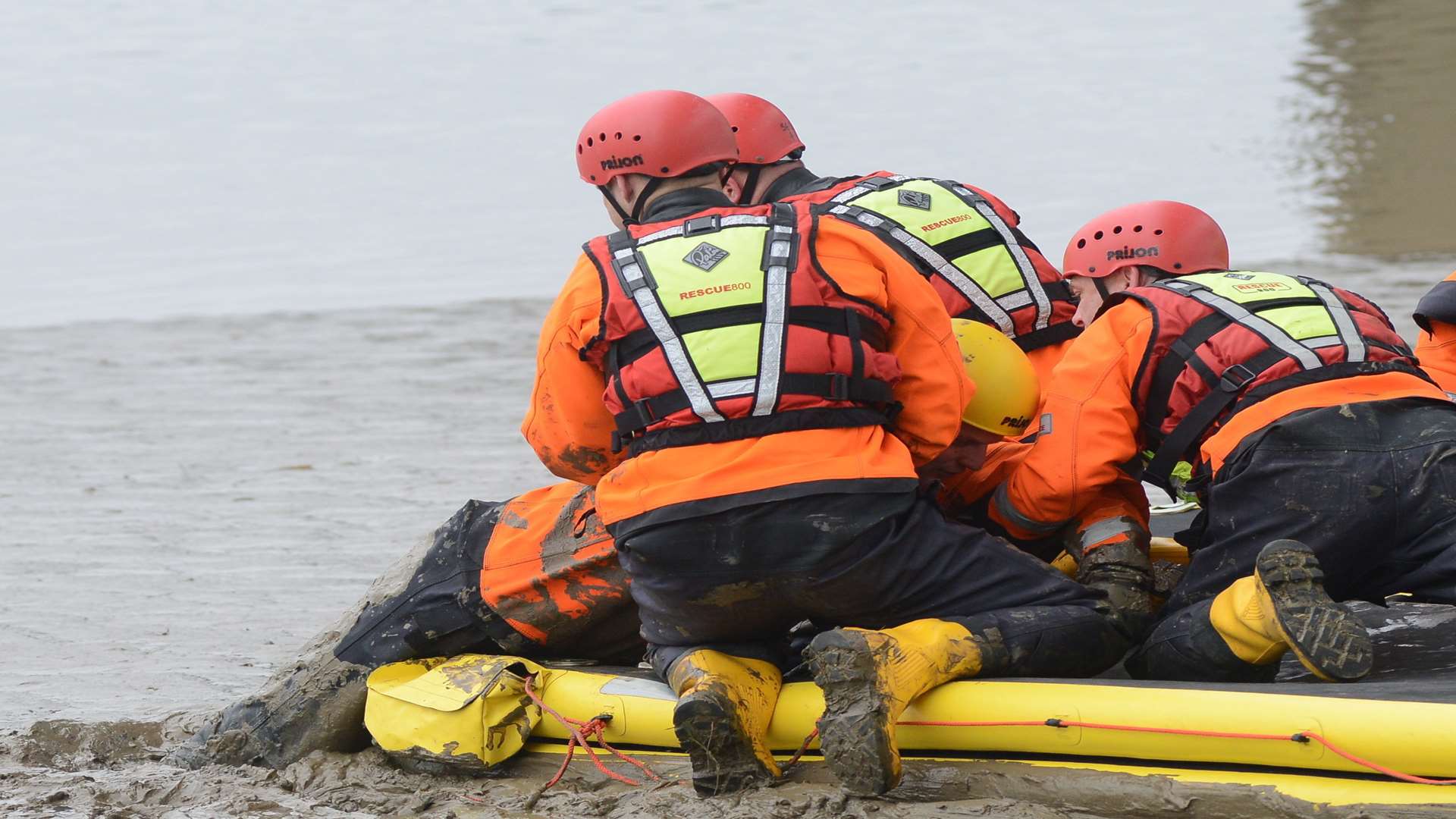 The firefighters use floats to reach people stranded.