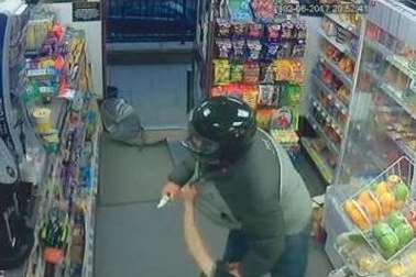 The picture posted online of a distinctive armed robber who has struck several times