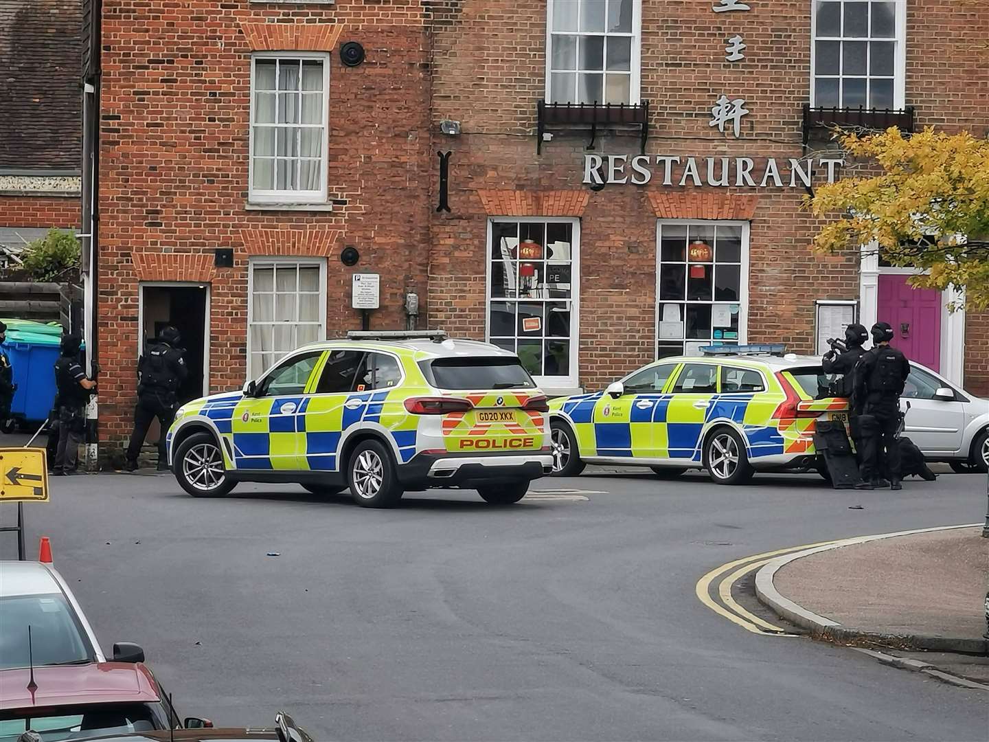 Armed police at a building next to the Royal Inn Chinese restaurant in Monastery Street, Canterbury. Picture: Kieran Scopes