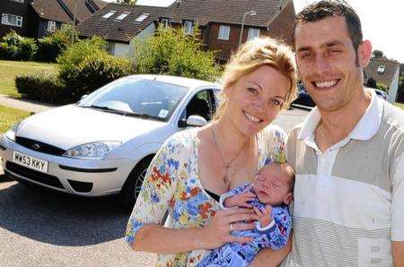Gavin and Jess Attwood with baby Riley - born in their back of their Ford Focus