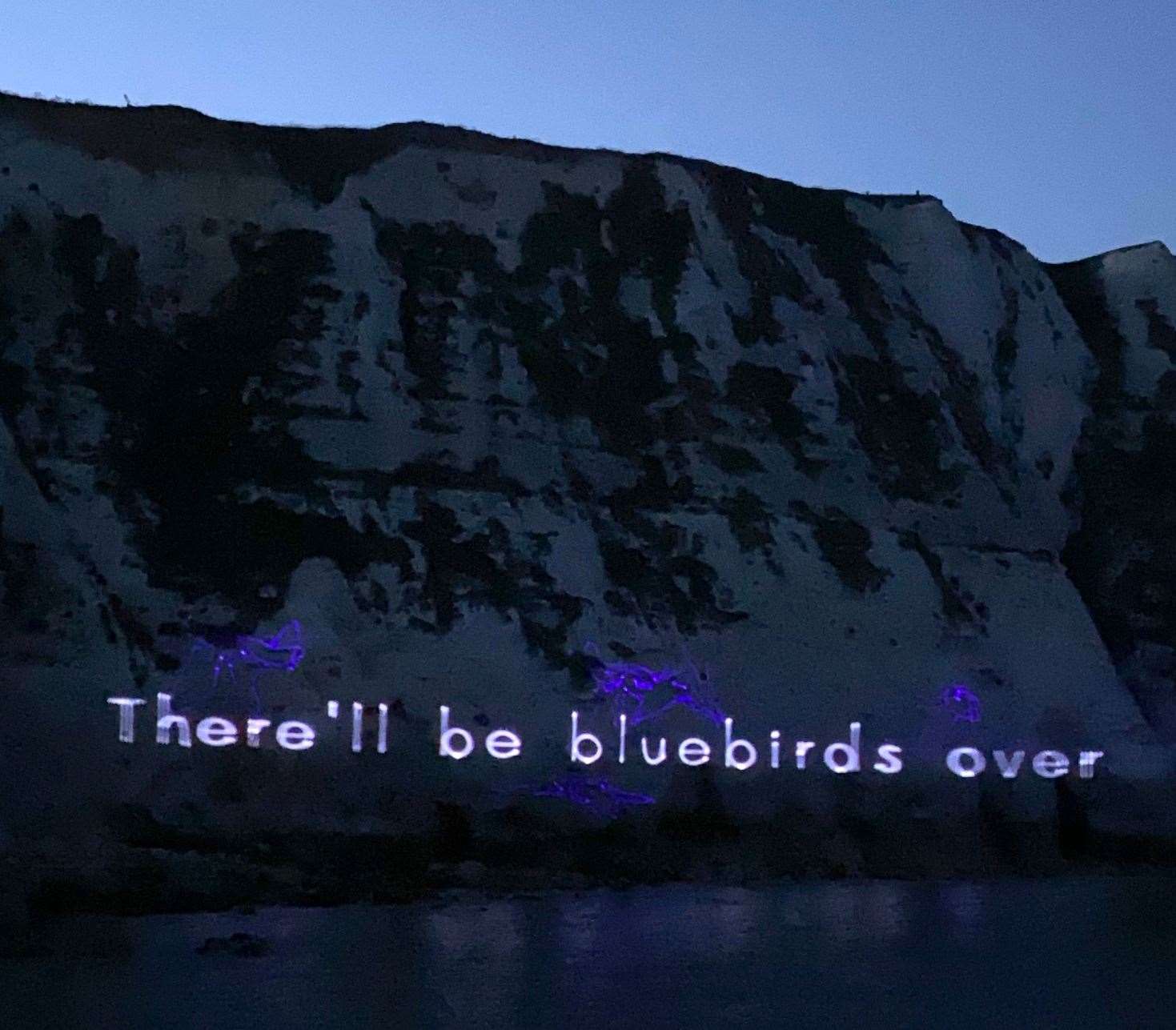 Beamed laser tribute to Dame Vera Lynn on the White Cliffs of Dover at Samphire Hoe Country Park. Picture: Barry Goodwin