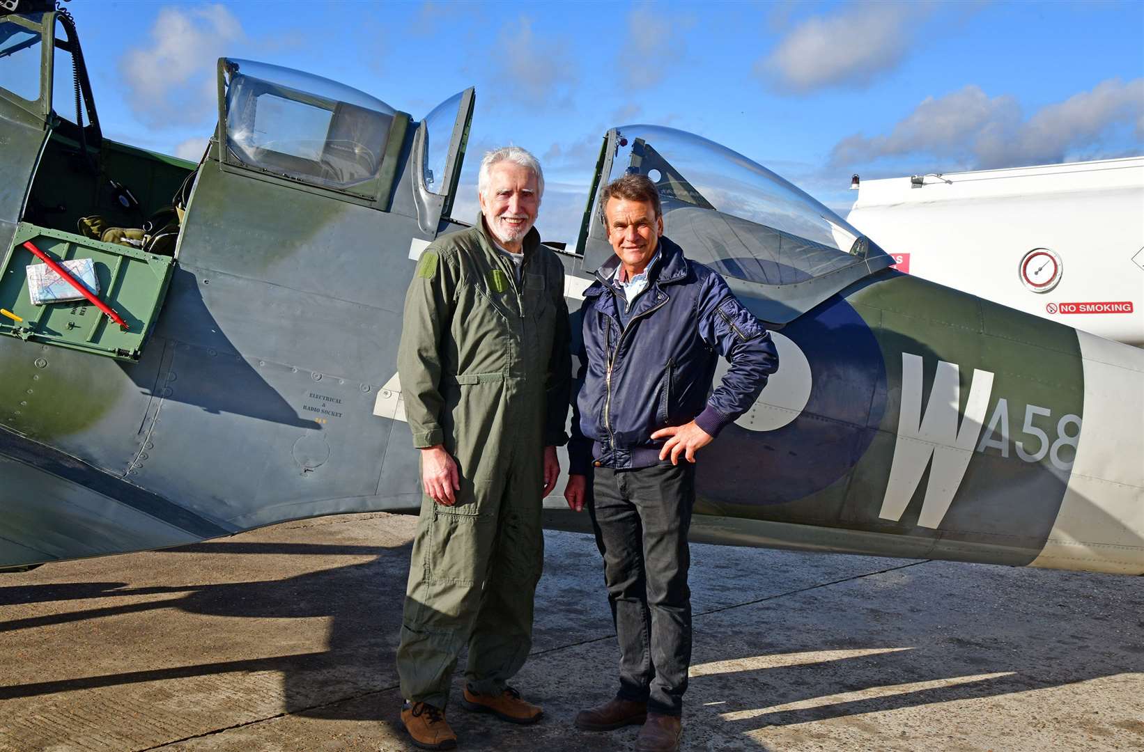 Peter Arnold, pictured with owner and pilot Peter Monk, was reunited with the first Spitfire he ever flew 50 years ago which is now based at the Biggin Hill Heritage Hangar. He was treated to a flight over Kent including landmarks such as Leeds Castle. Picture: Richard Paver/Biggin Hill Heritage Hangar
