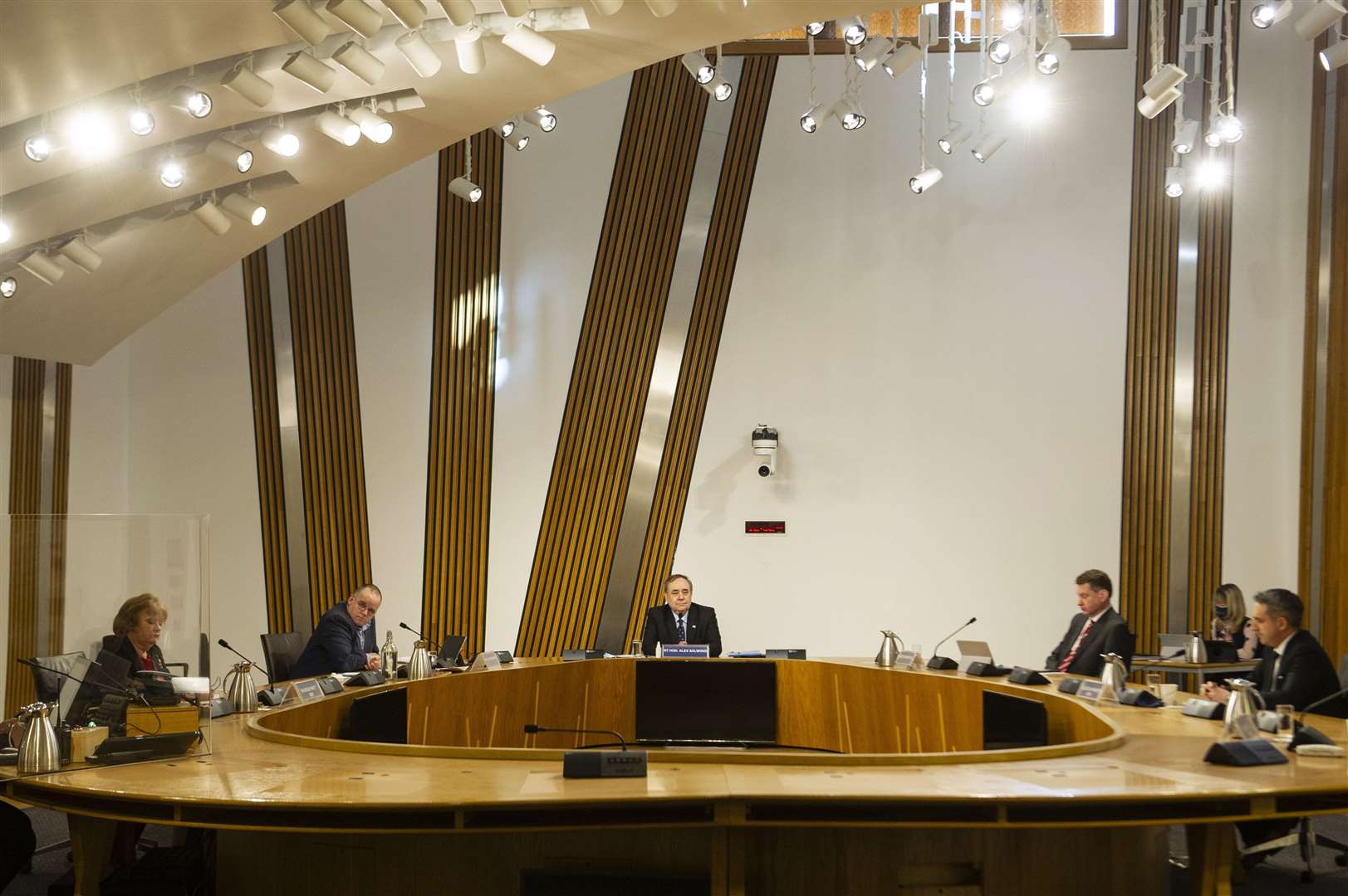 Mr Salmond, centre, is appearing in person before the Holyrood committee (Andy Buchanan/PA)