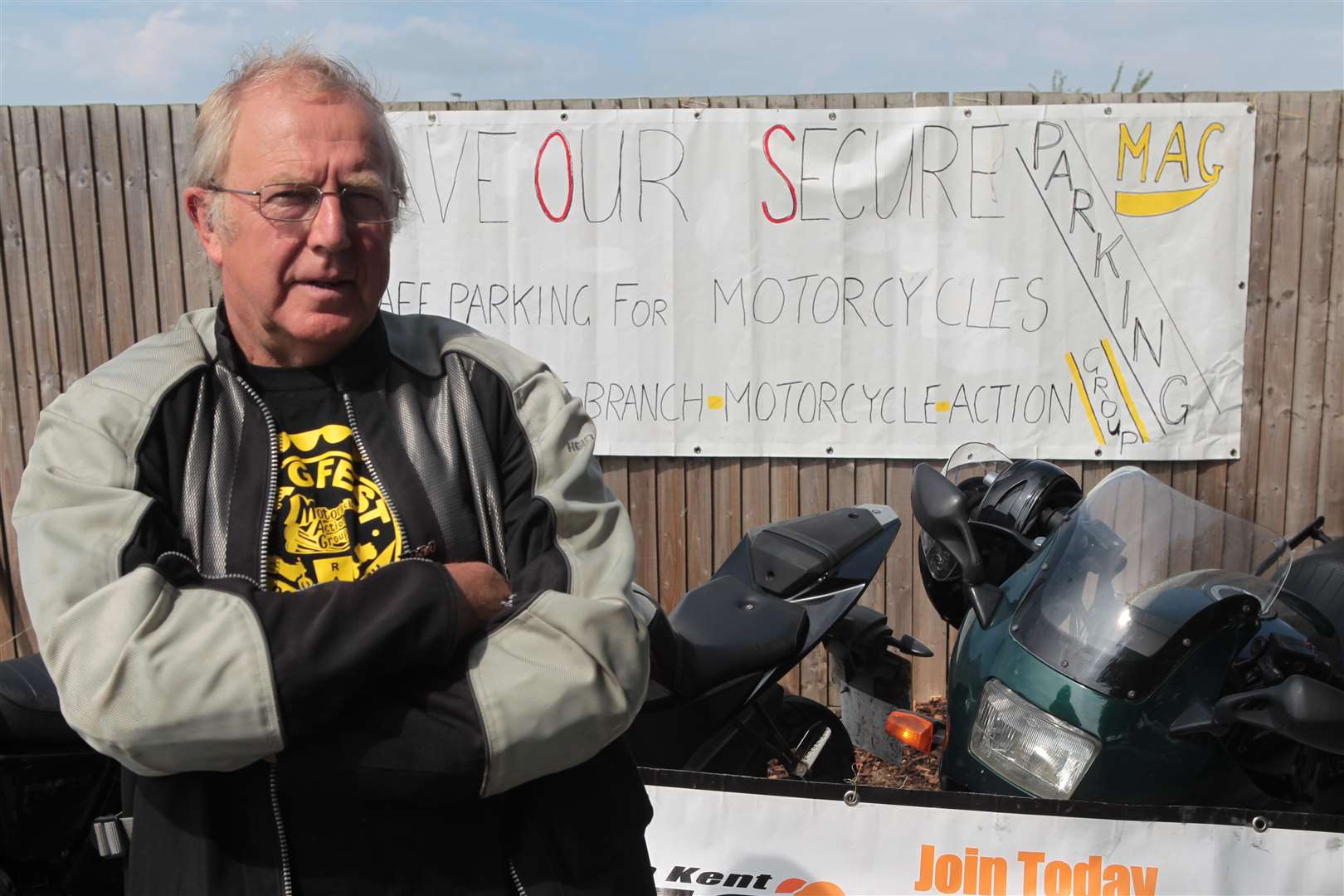 Steve Mallett , a representative of North Kent Motorcycle Action Group stands in protest at lack of secure and adequate parking for bikes in the revamped carpark. Picture by: John Westhrop. (2891691)