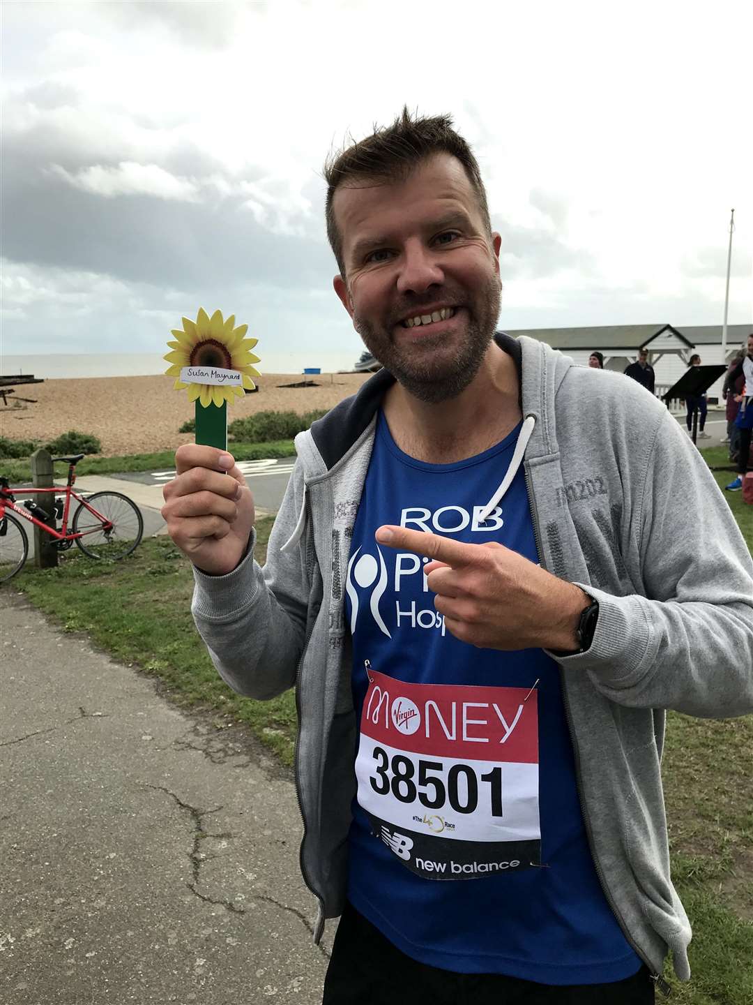 London Marathon 2021: Rob Maynard a the finsh of the virtual marathon in October with his mum's sunflower (50185448)