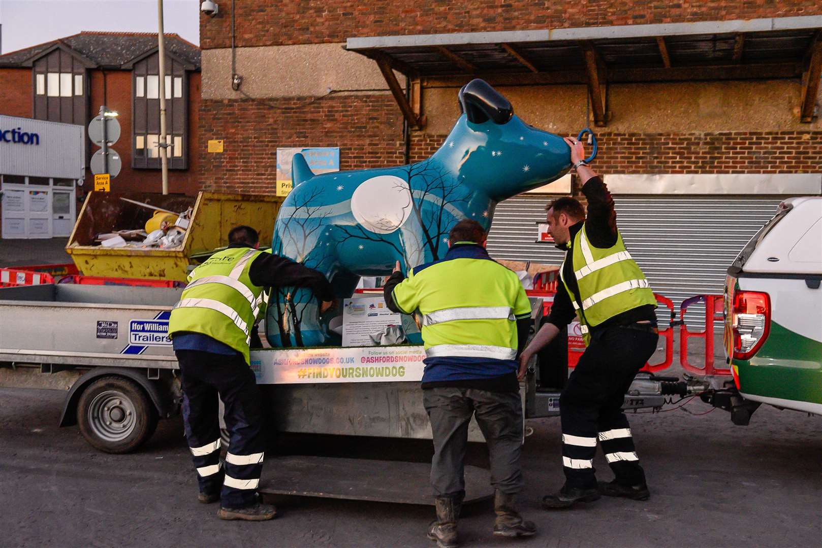 Emma Dove's Snowdog, Zeus, being manhandled onto a truck ahead of its removal on Sunday. Picture: Alan Langley.