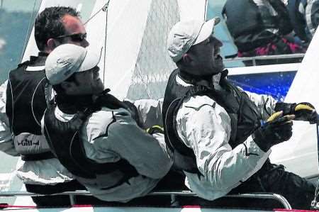 Downs Sailing Club's Adam Heeley, centre, on his way to Laser SB3 world title success in Portuga;