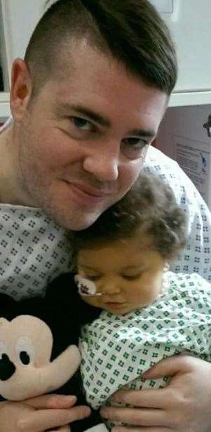 Ross Wooding with his son Hugo in hospital